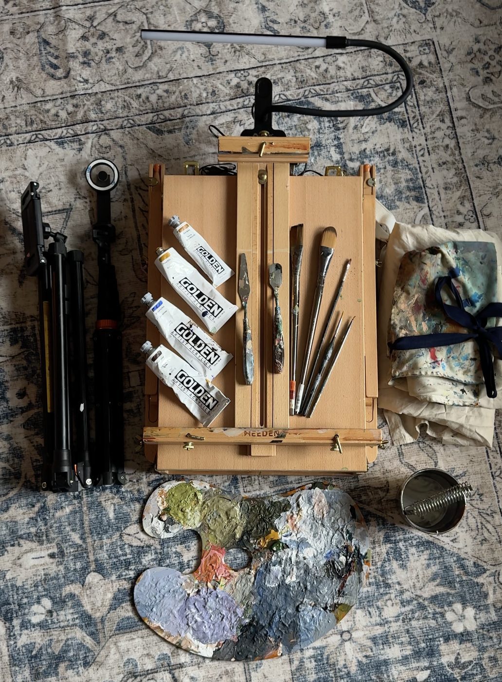 The travelling paint box open and packed, brushes, palette and tools each in their place