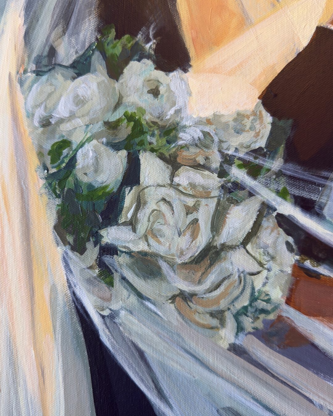 Detail from Only Us — the bride's white rose bouquet held against her gown, the veil falling across it