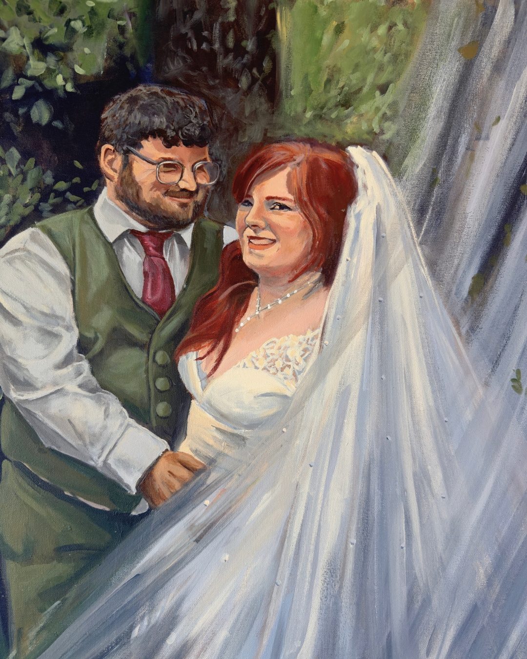 There You Are — a bride in a long veil laughing beside her groom in a green vest, trees behind them